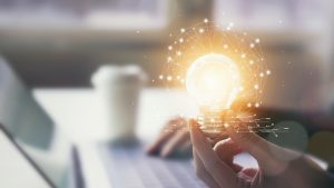 Hand holding lightbulb - Northmore Gordon