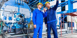 Boiler upgrades - workers with hard hats - Northmore Gordon