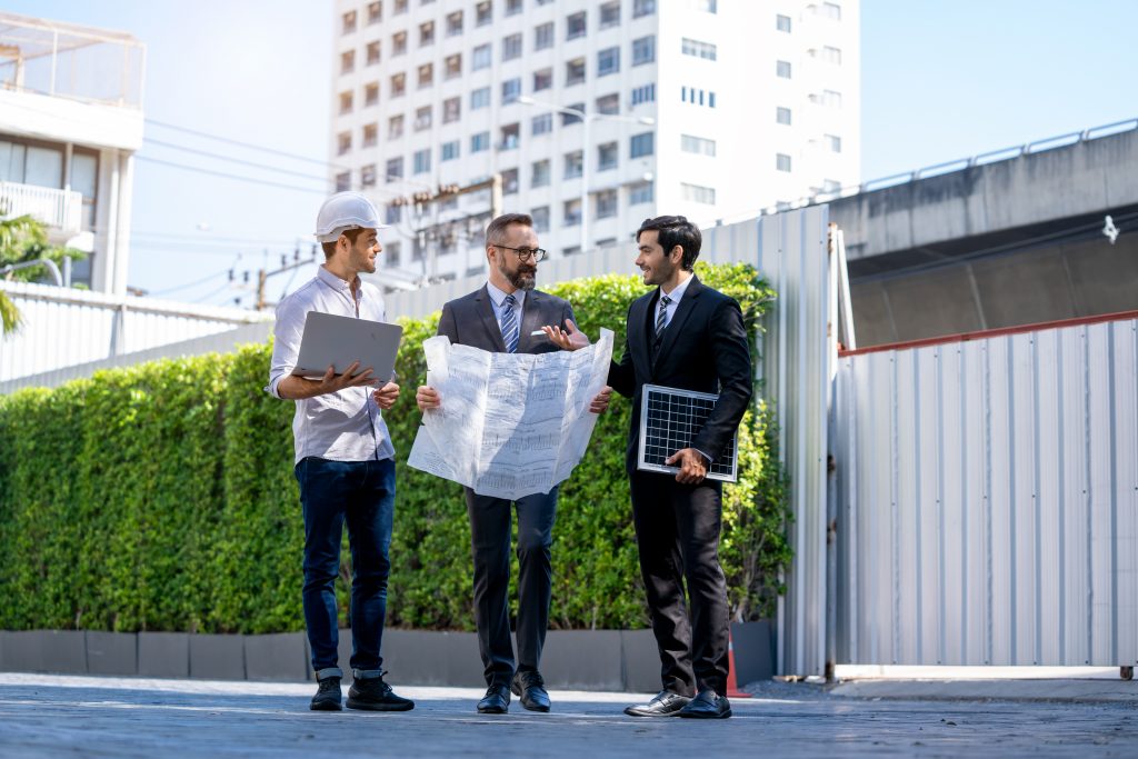 Energy efficiency starts with sales | Engineers talking infront of buildings | Northmore Gordon